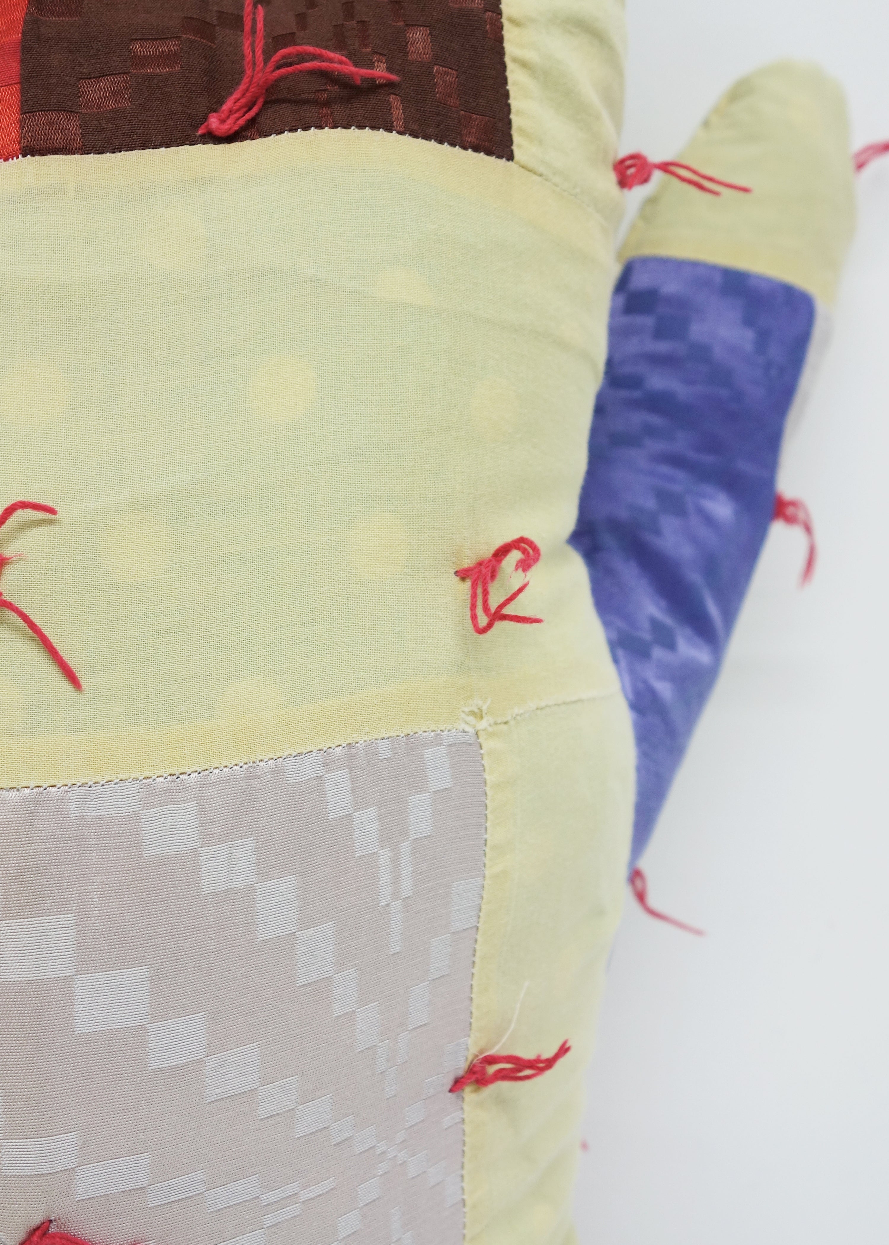 Left Hand in Geometric Quilt
