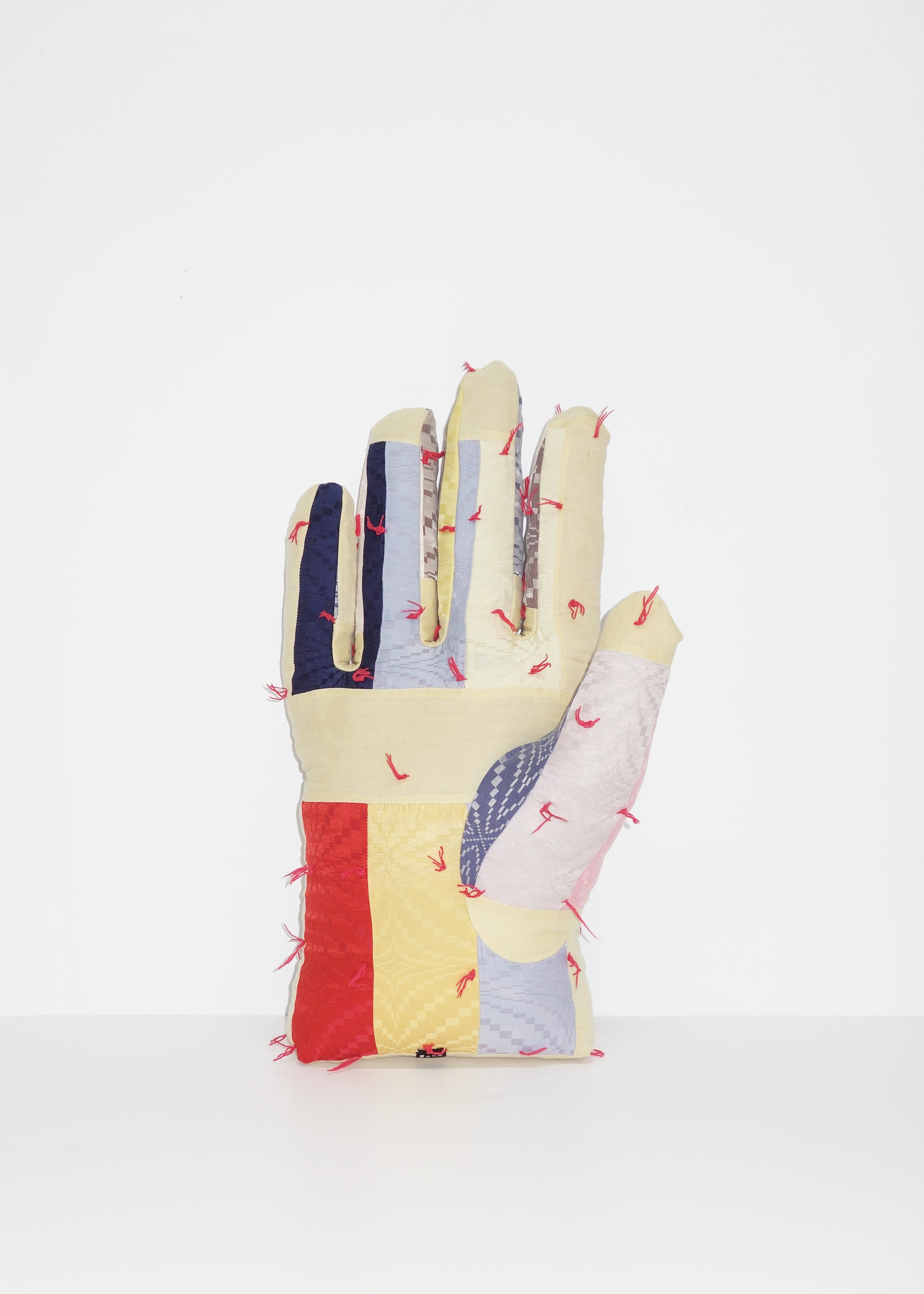 Right Hand in Geometric Quilt